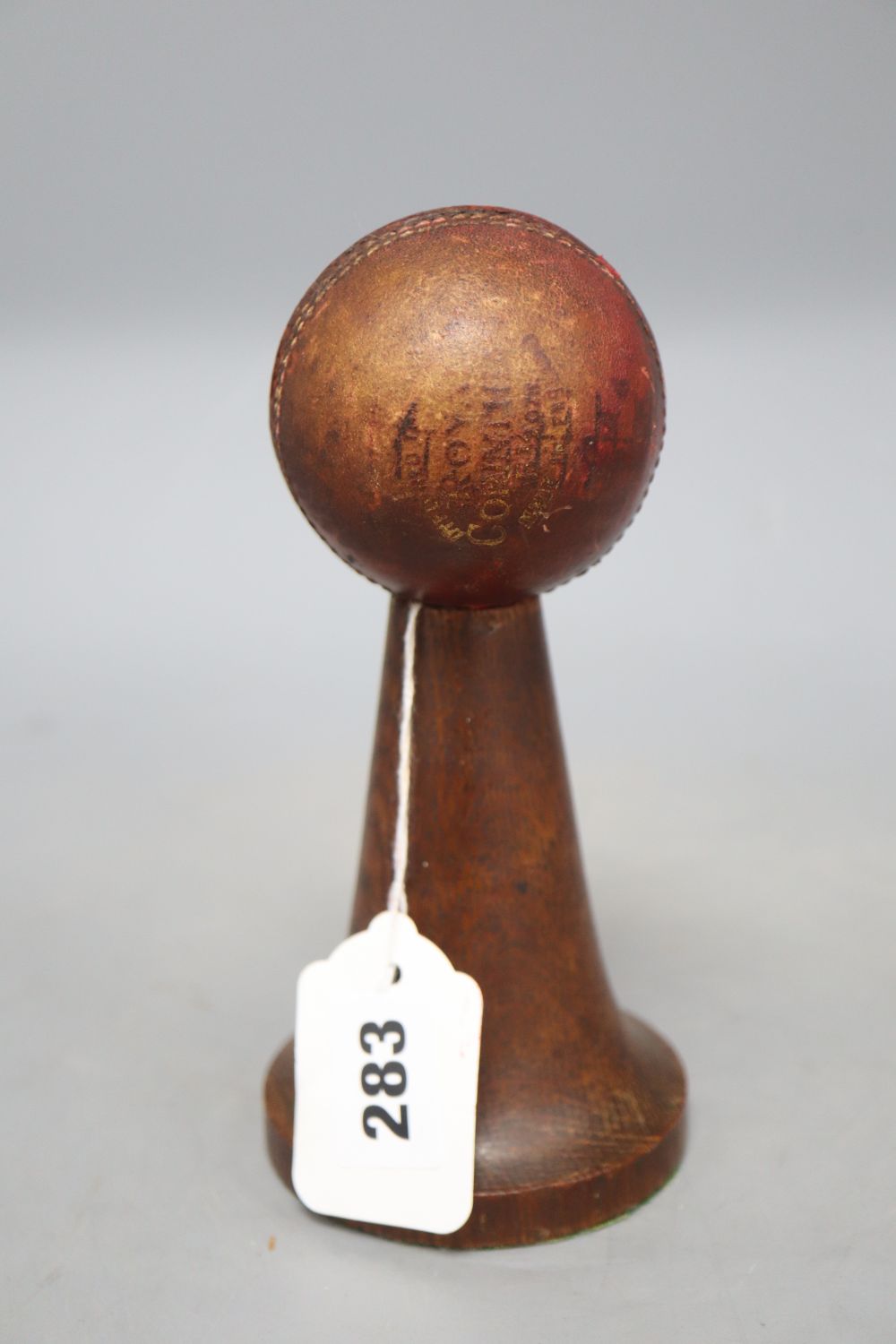 A mid 20th century cricket trophy, with silver plaque, height 18cm